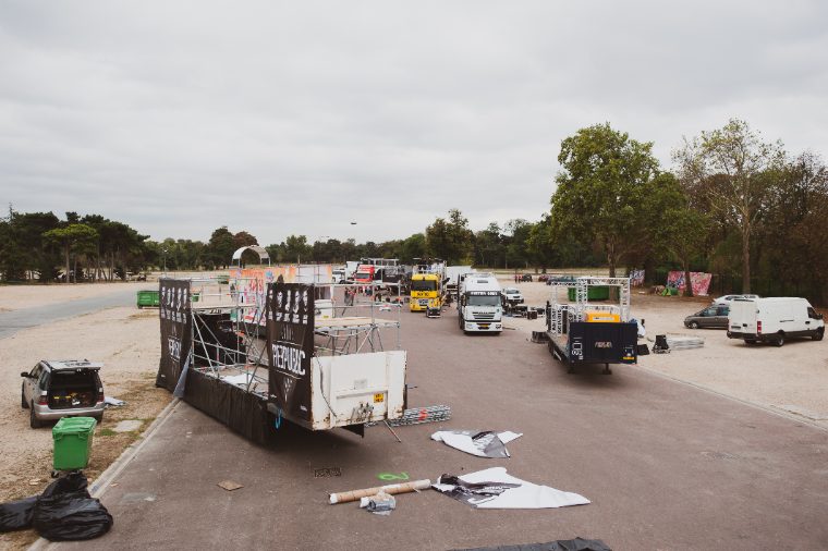 The staging lot at dawn, floats being dressed